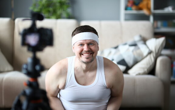 Smiling Vlogger Recording Fitness Video on Camera. Happy Bearded Man Shooting Video for Sport Vlog in Apartment. Guy Practice Healthy Lifestyle. Cheerful Sportsman Head and Shoulders Portrait