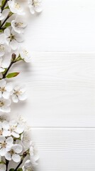 White spring blossoms arranged on whitewashed wooden surface, pure and minimalist aesthetic