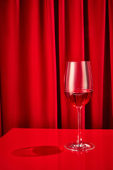 Close up photo of sweet red, pink seasoned wine served in high glass classy on bar counter at restaurant. Concept of night life, party time, holidays, Valentines Day, celebration. Ad