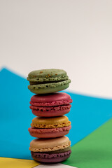 Fototapeta na wymiar Macarons french dessert, macarons on a colorful background, delicious sweet dessert 