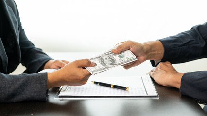 Corrupt officials accept money from businessmen concept of corruption Government officials accept...
