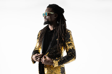 stylish african man in a shiny jacket and sunglasses