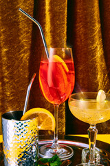 Close up photo of sweet and sour cocktails, alcohol drinks, stands on shiny silver tray on bar...