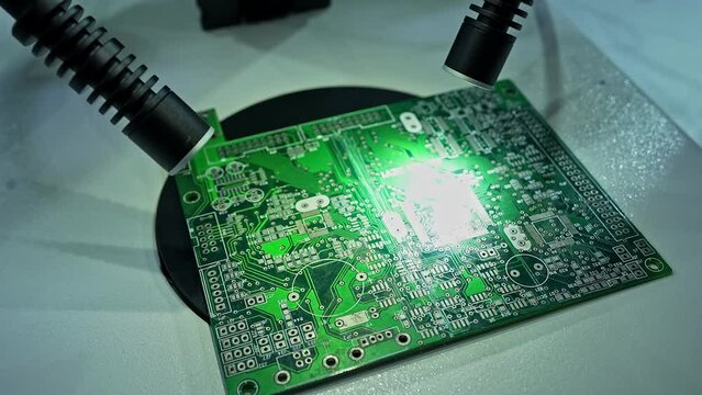 Closeup of Inspecting motherboard with stereo microscope with FusionOptics technology