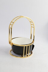 A collection of black and olive dishes inlaid with gold