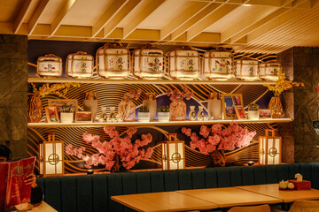 Floral Serenity: Cozy Japanese Restaurant with Lanterns on Wall