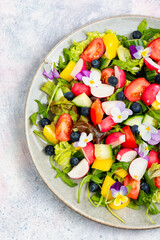 Vegetable salad decorated with flowers.