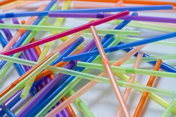 Jumble of colorful single use drinking straws