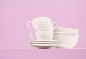 Dishes assortment. Modern clean dinnerware. Copy space for text.