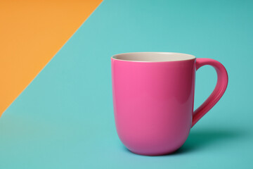 beautiful mug. pink mug on a colored background. drink cup concept