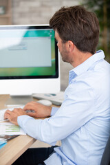 Fototapeta premium a man is computing in office