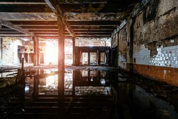 Dark flooded rotten abandoned industrial building
