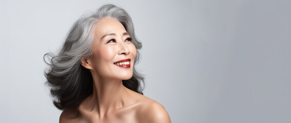 Korean woman face with smooth healthy neckline skin. Korean, Chinese asian Beautiful aging years old, young looking smiling woman, beauty health skincare and cosmetics advertising concept - obrazy, fototapety, plakaty