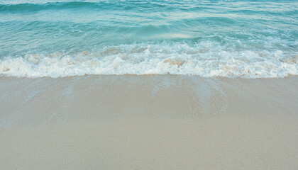Soft wave of blue ocean on sandy beach. Summer vacation in island. clear azure water Background.