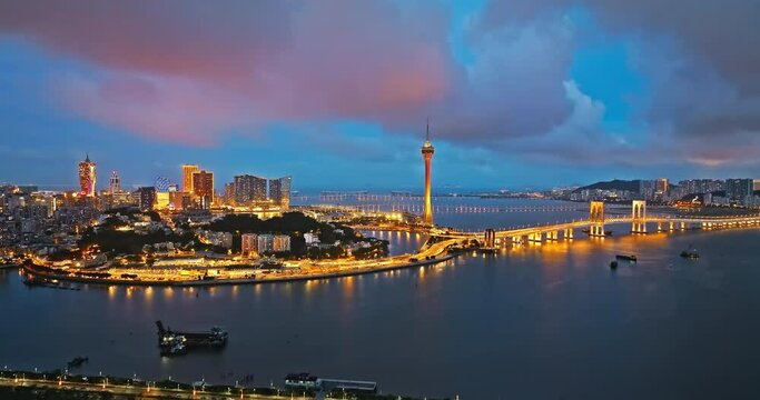 Aerial view of Macau city skyline with modern buildings scenery at night, China. beautiful coastline scenery. Famous travel destination. 