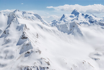 Snowy mountains. Beautiful landscape with snowy rocks. View from the top of Mount Elbrus