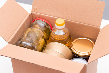 Food Reserves or Donation Box: Carton Box with Canned Food, Cereals and Grocery. Emergency Food...