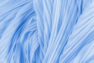 Soft air waves of blue colored silk or chiffon fabric. Chic abstract festive background. Design...