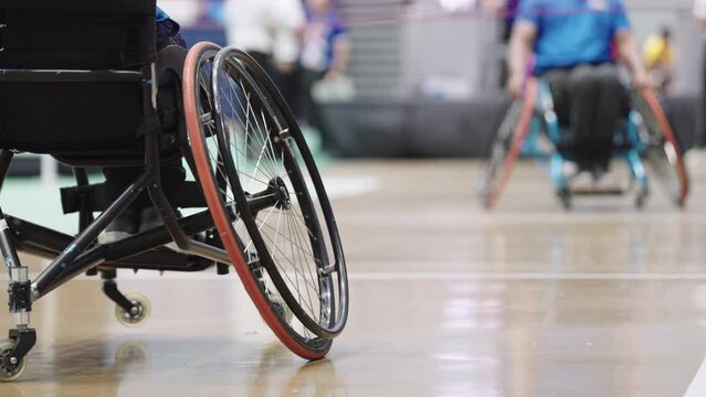 Take a video from behind Enjoy life Asian male sits in a competitive wheelchair preparation before a match training badminton