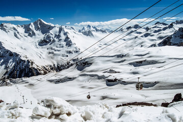 Snowy mountains. Beautiful landscape with snowy rocks. View from the top of Mount Elbrus - 696344376