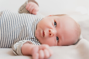 Portrait of 2 weeks old baby. Newborn baby at first months of life.