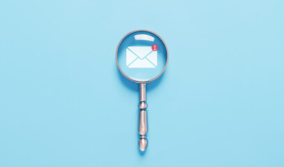 magnifying glass shows an icon for new email, sending an information message email from the tablet....