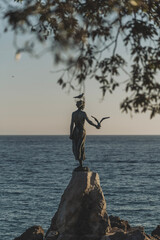 statue on the sea