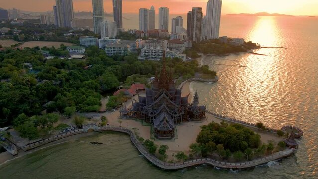 The Sanctuary of Truth wooden temple in Pattaya Thailand is a gigantic wood construction located at the cape of Naklua Pattaya City. sCity skyline of Pattay during sunset