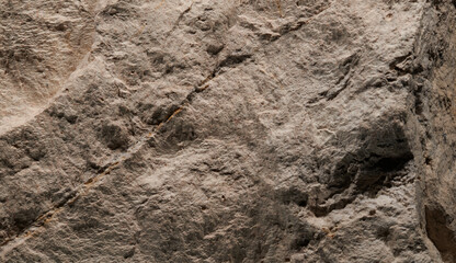 Brown stone texture, dark abstract background. Natural mineral rock close up details, empty backdrop with copy space for design