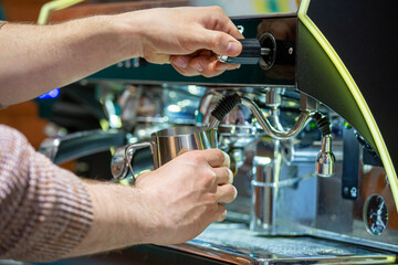 Fototapeta na wymiar Barista coffee service concept.Barista women using coffee machine to make coffee in cafe