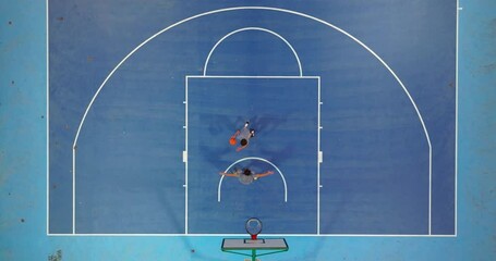 Sport and family friendship. Aerial view family playing basketball on outdoor court. The family spends their free time together playing sports and playing basketball on the basketball court