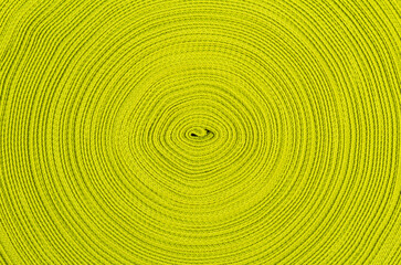 Fototapeta na wymiar Background of green ribbon wound in a circle. View from above
