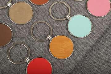 Metal and leather keychains. Colorful one side leather; Square, rectangle and circle shaped key rings. Concept shots, photos taken specially for e-commerce sales.