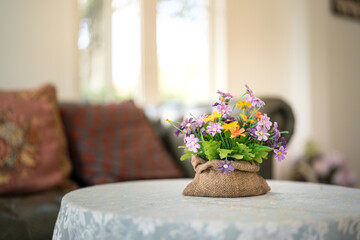 An artificial flowerpot which is placed on the cupboard or desk for decorating the living room....