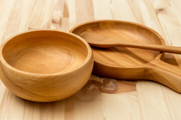 wooden utensils. light wood dishes on the table. wood products concept
