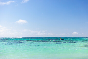 Fototapeta na wymiar Anse Royale, Seychelles. Coastal view with small fishing boat