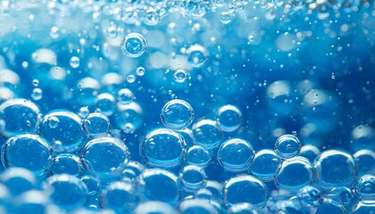 pure effervescent vitality cosmetic refreshing hygiene or hydrogen blue energy studio shot of carbonated blue gas bubbles under water in full frame macro close up with selective focus blur - obrazy, fototapety, plakaty
