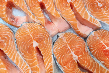 Fresh salmon chunks on market stalls