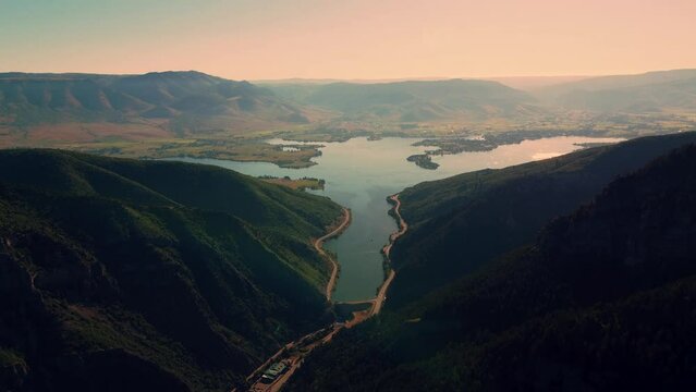 Aerial Footage overlooking Utah Pineview Reservoir and Vast Mountains