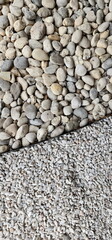 Small and large decorative and garden stones are arranged using black wire to divide them into sections. natural stone background Small and medium sized stones are used decorate gardens or pave roads.