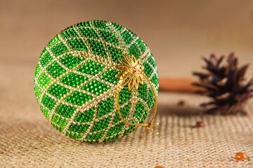 Exquisite handmade Christmas bubble toy from beads, also known as a Christmas globe or Christmas bulb, is a part of holiday decor.