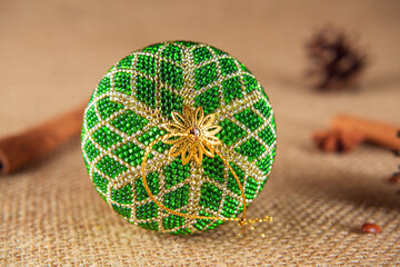 Exquisite handmade Christmas bubble toy from beads, also known as a Christmas globe or Christmas bulb, is a part of holiday decor.