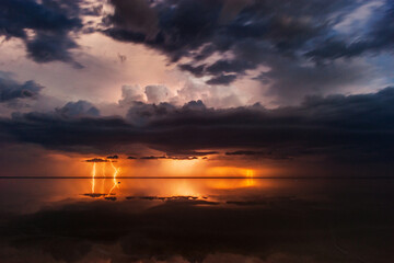 Thunderous dark sky. Black clouds and thunderstorm lightning.Concept on the theme stormy,...