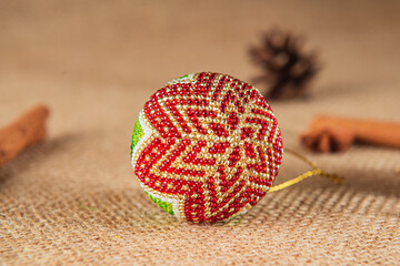 Exquisite handmade Christmas bubble toy from beads, also known as a Christmas globe or Christmas bulb, is a part of holiday decor.