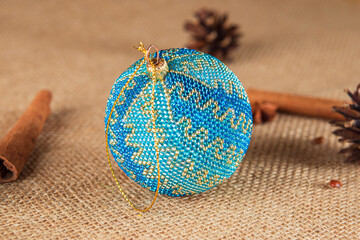 Exquisite handmade Christmas bubble toy from beads, also known as a Christmas globe or Christmas bulb, is a part of holiday decor.