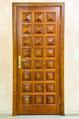 Wooden door to the wall of the house. Background