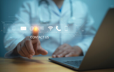 Medical worker using a laptop and touching on virtual screen contact icons email, address, live...