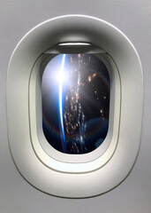 View from a porthole on the night Earth planet. Elements of this image furnished by NASA.