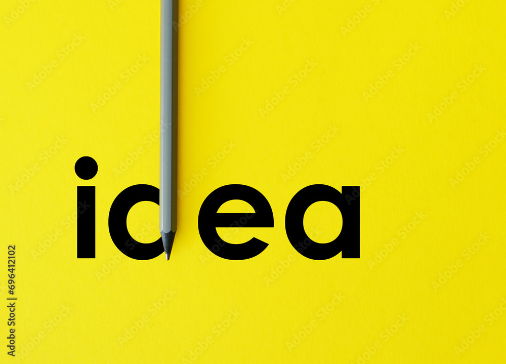 Poster the word idea is shown using composition with grey pencil isolated on yellow paper that look minimal