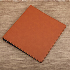 Personalized binding, leather folder cover, leather binding, binder, binder, office binding, corporate gift. Concept shot leather binding, top view, colorful